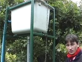 Tao at the water turbine exhibit just before his helmet ended up in the watery bog behind the fence, much to everyone's amusement